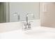 Modern bathroom sink with chrome faucet and a large mirror at 121 Priestwood Ln, Acworth, GA 30102