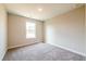 Bedroom with neutral colored walls and carpet and a window at 121 Priestwood Ln, Acworth, GA 30102