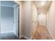Hallway with carpet and white doors leading to rooms, including a walk-in closet at 121 Priestwood Ln, Acworth, GA 30102