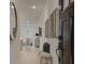 Inviting hallway with wood floors, decor mirror, and a seating area with pillows and light at 121 Priestwood Ln, Acworth, GA 30102