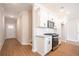 Well-appointed kitchen features white cabinets, subway tile backsplash, and modern appliances at 121 Priestwood Ln, Acworth, GA 30102
