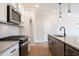 Well-equipped kitchen with granite countertops, a gray island, and stainless steel appliances at 121 Priestwood Ln, Acworth, GA 30102