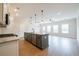 Spacious kitchen with gray island, granite countertops, and modern appliances at 121 Priestwood Ln, Acworth, GA 30102