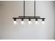 Contemporary dining room light fixture with five bulbs hanging from the ceiling at 121 Priestwood Ln, Acworth, GA 30102