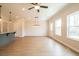 Open concept features light wood flooring and kitchen with white cabinets at 121 Priestwood Ln, Acworth, GA 30102