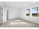 Bright, carpeted bedroom with natural light from windows and a convenient double-door closet at 3188 Eastham Run Dr, Dacula, GA 30019