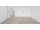 Hallway with neutral carpeting, white trim and doors leading to other rooms in the house at 3188 Eastham Run Dr, Dacula, GA 30019