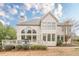 Charming back exterior showcasing large windows and a lovely deck, providing ample natural light at 5825 Laurel Oak Dr, Suwanee, GA 30024