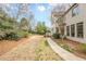 Expansive backyard with a paved pathway, ideal for outdoor activities and relaxation at 5825 Laurel Oak Dr, Suwanee, GA 30024