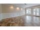 Finished basement area features tile flooring, recessed lighting, and access to the outside at 5825 Laurel Oak Dr, Suwanee, GA 30024