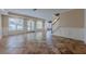 Basement living area featuring tiled flooring, large windows and a staircase to main floor at 5825 Laurel Oak Dr, Suwanee, GA 30024