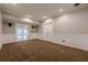 Finished basement featuring carpet flooring, recessed lighting, and white trim at 5825 Laurel Oak Dr, Suwanee, GA 30024