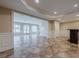 Spacious finished basement with tile flooring, recessed lighting, and wet bar at 5825 Laurel Oak Dr, Suwanee, GA 30024