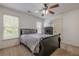 Bedroom with carpeted floor, ceiling fan and natural light at 5825 Laurel Oak Dr, Suwanee, GA 30024