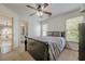 Bedroom featuring natural light and connecting doors to the hallway and bathroom at 5825 Laurel Oak Dr, Suwanee, GA 30024