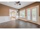 Bonus room with ceiling fan, hardwood flooring, and natural light at 5825 Laurel Oak Dr, Suwanee, GA 30024