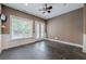 Bonus room with ceiling fan, hardwood flooring, and natural light at 5825 Laurel Oak Dr, Suwanee, GA 30024