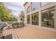 This deck has seating for six, with large windows looking into the property at 5825 Laurel Oak Dr, Suwanee, GA 30024