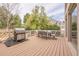 This deck has a stainless steel BBQ grill and outdoor seating, and an open view at 5825 Laurel Oak Dr, Suwanee, GA 30024