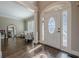 Bright foyer with hardwood floors, arched doorway, and decorative trim at 5825 Laurel Oak Dr, Suwanee, GA 30024