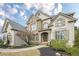 Beautiful home with a stone-accented facade, manicured lawn, and inviting front entrance at 5825 Laurel Oak Dr, Suwanee, GA 30024