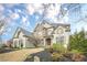 Charming two-story home featuring a stone facade and well-maintained landscaping at 5825 Laurel Oak Dr, Suwanee, GA 30024