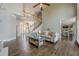 Expansive living area with high ceilings, staircase, and seamless transition to the open kitchen at 5825 Laurel Oak Dr, Suwanee, GA 30024