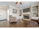 Inviting living room with beautiful hardwood floors and a stone fireplace at 5825 Laurel Oak Dr, Suwanee, GA 30024