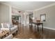 Open-concept living room showcasing hardwood floors and elegant architecture, bathed in natural light at 5825 Laurel Oak Dr, Suwanee, GA 30024