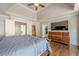 Bedroom with hardwood floors and access to a walk-in closet and ensuite bathroom at 5825 Laurel Oak Dr, Suwanee, GA 30024