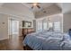 Spacious main bedroom with tray ceiling, hardwood floors, and walk-in closet access at 5825 Laurel Oak Dr, Suwanee, GA 30024