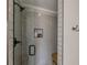 Contemporary tiled shower with glass door and built-in niche at 5825 Laurel Oak Dr, Suwanee, GA 30024