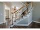 Elegant staircase with white railing and wooden accents leading to upper floors at 5825 Laurel Oak Dr, Suwanee, GA 30024