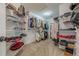Walk-in closet with built-in shelving offers ample storage and organization space at 5825 Laurel Oak Dr, Suwanee, GA 30024