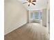 Spacious bedroom with a ceiling fan and natural light from the large window at 624 Ironstone Dr, Fairburn, GA 30213