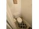 Compact bathroom with a white toilet and patterned rug at 8538 Westchester Dr, Douglasville, GA 30134