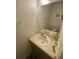 Bathroom featuring a large mirror, vanity sink, and a neutral color scheme at 8538 Westchester Dr, Douglasville, GA 30134