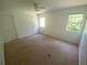 A bright bedroom with a ceiling fan and natural light from two windows at 8538 Westchester Dr, Douglasville, GA 30134