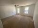 Bedroom with two windows, ceiling fan and neutral walls at 8538 Westchester Dr, Douglasville, GA 30134