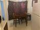 Cozy dining area featuring a dark wood table and chairs, complemented by patterned curtains at 8538 Westchester Dr, Douglasville, GA 30134