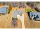 Aerial view of the home showcasing the driveway, yard, and landscaping at 95 Gorham Gates Dr, Hiram, GA 30141