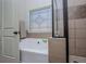 Luxurious soaking tub with decorative window, adjacent to a tiled shower at 95 Gorham Gates Dr, Hiram, GA 30141