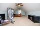 Spacious attic bedroom featuring sloped ceilings, carpet flooring and a ceiling fan at 95 Gorham Gates Dr, Hiram, GA 30141