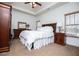 Comfortable bedroom with a ceiling fan, carpet, and natural light at 95 Gorham Gates Dr, Hiram, GA 30141