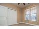 Comfortable bedroom with carpet flooring, closet and large window at 95 Gorham Gates Dr, Hiram, GA 30141