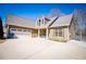 Exterior view of a home with an attached garage and a wide driveway at 95 Gorham Gates Dr, Hiram, GA 30141