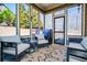 Cozy screened porch with seating offering great views and fresh air at 95 Gorham Gates Dr, Hiram, GA 30141