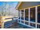 Charming screened porch that connects to the wooded backyard with a fence at 95 Gorham Gates Dr, Hiram, GA 30141