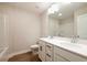 Bathroom featuring a double sink vanity with modern fixtures, a large mirror, and a shower/tub at 109 Priestwood Ln, Acworth, GA 30102