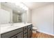 Stylish bathroom with dual sinks, stone counters, and glass-enclosed shower at 109 Priestwood Ln, Acworth, GA 30102